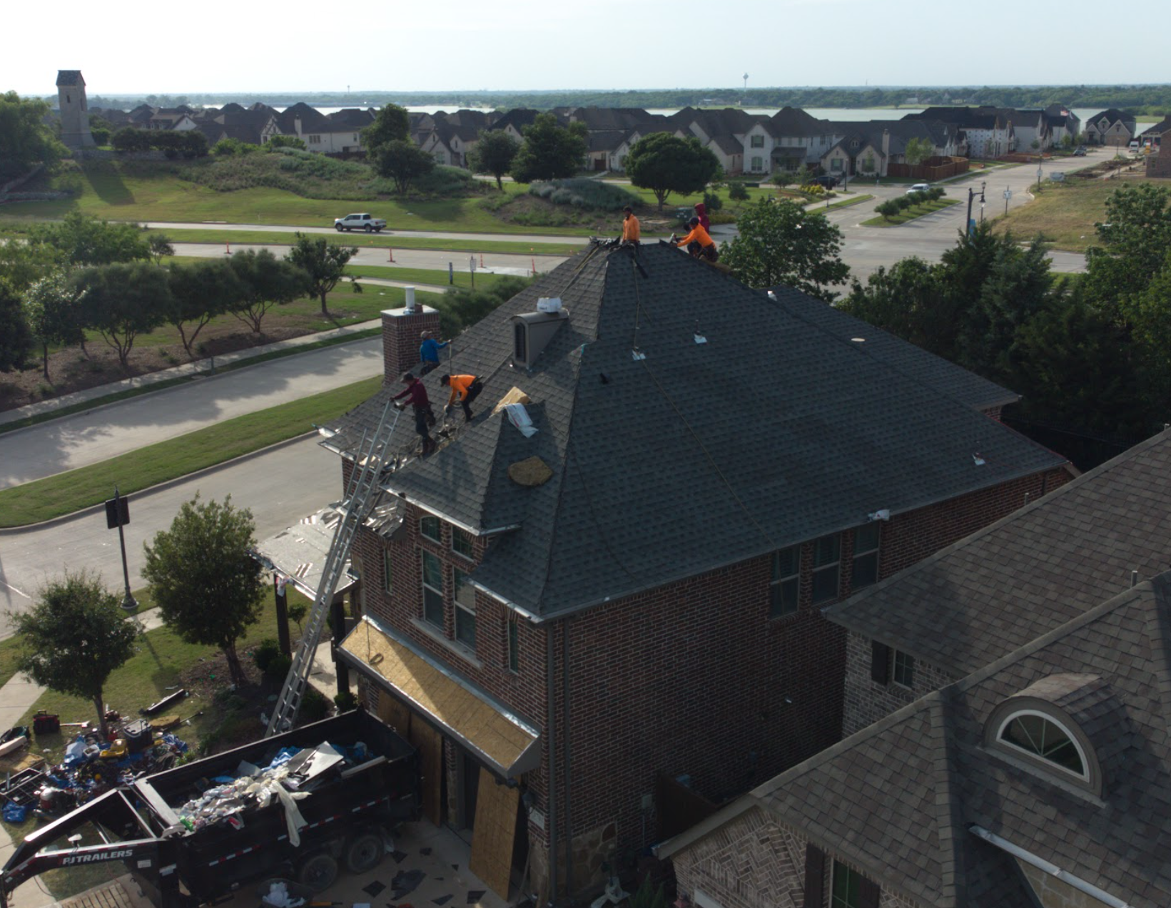 Local Dallas roofers working on a residential roof